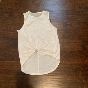 Lululemon tank with opening and mesh top on back.
